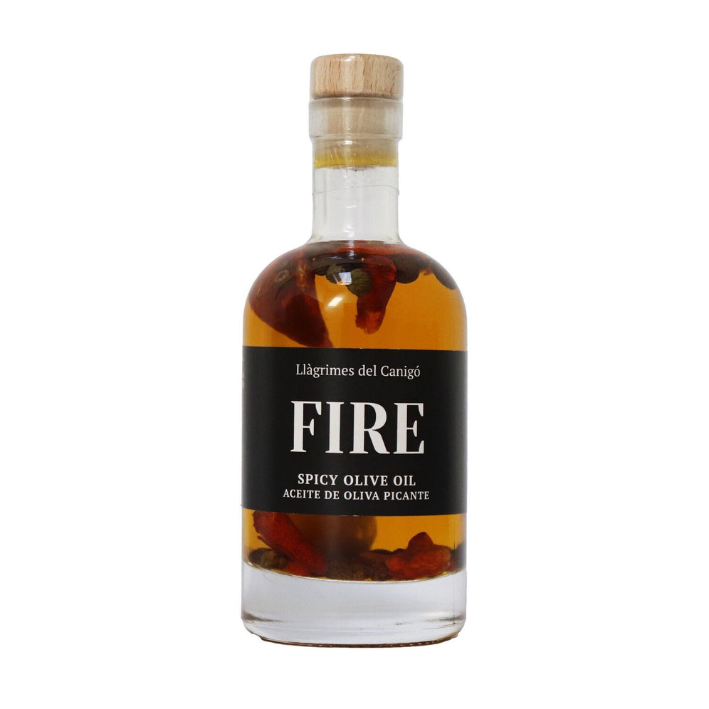 Bouteille de 100ml d'huile d'olive épicée FIRE, sauce piquante avec piment, ail et poivre de Llàgrimes del Canigó.